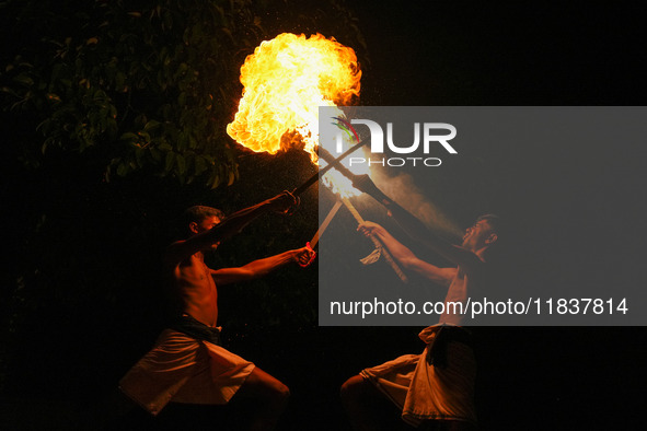 Angampora students perform their skills using fire and swords in Eheliyagoda, Sri Lanka, on December 5, 2024. Angampora is a 3,000-year-old...