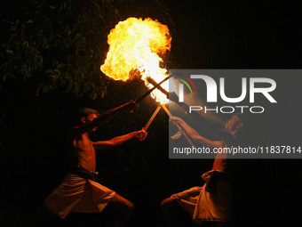 Angampora students perform their skills using fire and swords in Eheliyagoda, Sri Lanka, on December 5, 2024. Angampora is a 3,000-year-old...