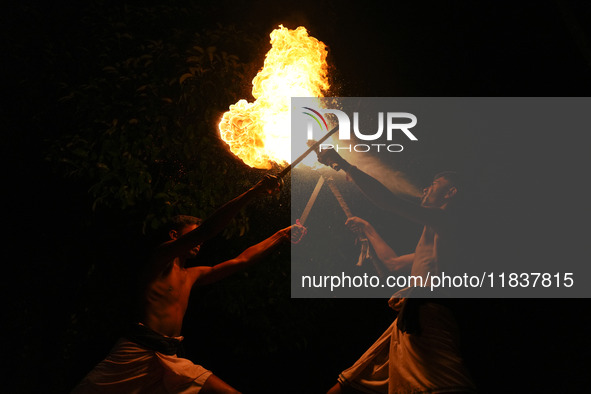 Angampora students perform their skills using fire and swords in Eheliyagoda, Sri Lanka, on December 5, 2024. Angampora is a 3,000-year-old...