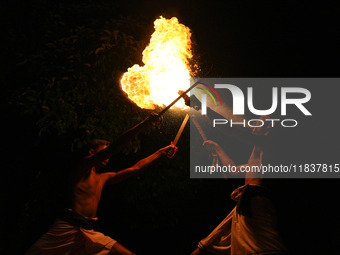 Angampora students perform their skills using fire and swords in Eheliyagoda, Sri Lanka, on December 5, 2024. Angampora is a 3,000-year-old...