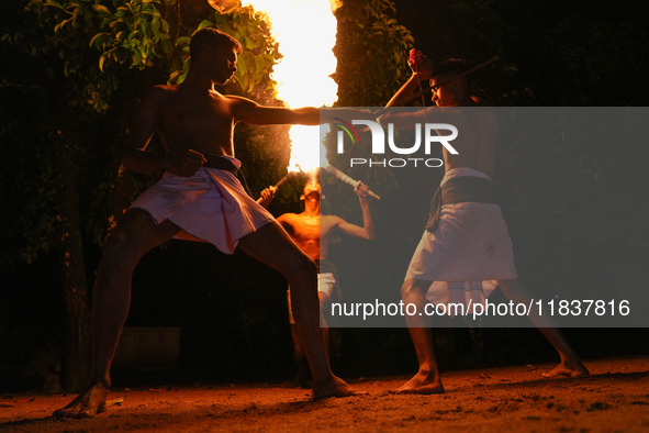 Angampora students perform their skills using fire and swords in Eheliyagoda, Sri Lanka, on December 5, 2024. Angampora is a 3,000-year-old...