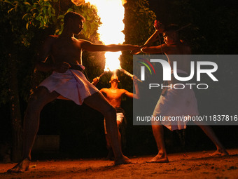 Angampora students perform their skills using fire and swords in Eheliyagoda, Sri Lanka, on December 5, 2024. Angampora is a 3,000-year-old...