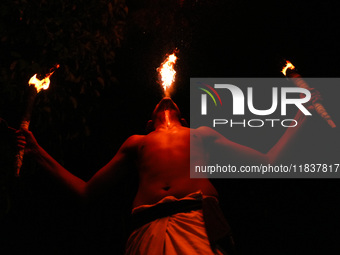 Angampora students perform their skills using fire in Eheliyagoda, Sri Lanka, on December 5, 2024. Angampora is a 3,000-year-old martial art...