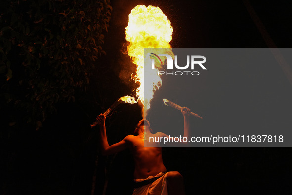 Angampora students perform their skills using fire in Eheliyagoda, Sri Lanka, on December 5, 2024. Angampora is a 3,000-year-old martial art...