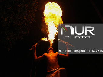 Angampora students perform their skills using fire in Eheliyagoda, Sri Lanka, on December 5, 2024. Angampora is a 3,000-year-old martial art...