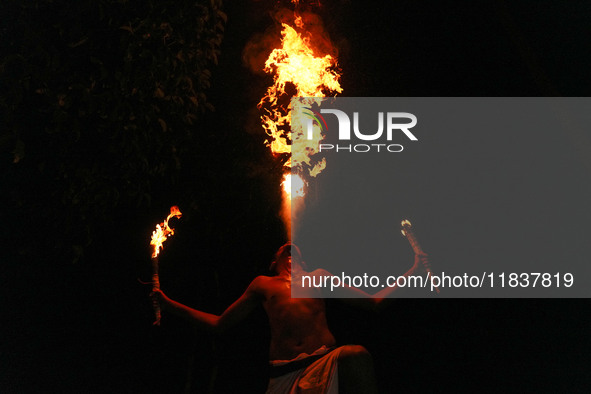 Angampora students perform their skills using fire in Eheliyagoda, Sri Lanka, on December 5, 2024. Angampora is a 3,000-year-old martial art...