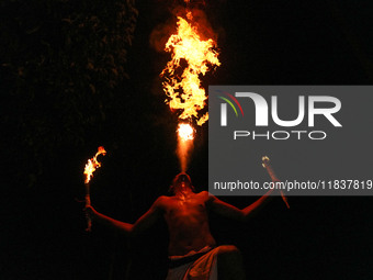 Angampora students perform their skills using fire in Eheliyagoda, Sri Lanka, on December 5, 2024. Angampora is a 3,000-year-old martial art...