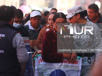 Relatives of the 43 students from the Normal Rural School of Ayotzinapa, victims of forced disappearance in 2014, attend a meeting with the...