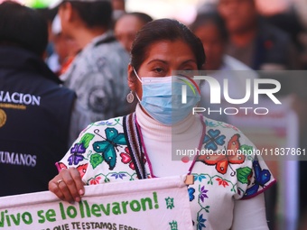 Relatives of the 43 students from the Normal Rural School of Ayotzinapa, victims of forced disappearance in 2014, attend a meeting with the...