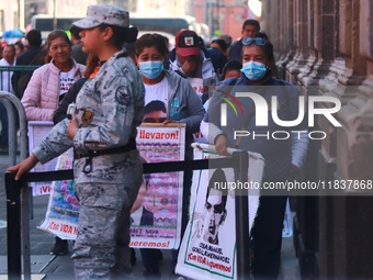 Relatives of the 43 students from the Normal Rural School of Ayotzinapa, victims of forced disappearance in 2014, attend a meeting with the...