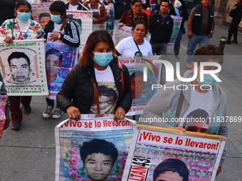 Relatives of the 43 students from the Normal Rural School of Ayotzinapa, victims of forced disappearance in 2014, attend a meeting with the...