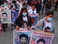 Relatives of the 43 students from the Normal Rural School of Ayotzinapa, victims of forced disappearance in 2014, attend a meeting with the...