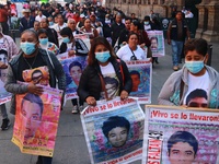 Relatives of the 43 students from the Normal Rural School of Ayotzinapa, victims of forced disappearance in 2014, attend a meeting with the...