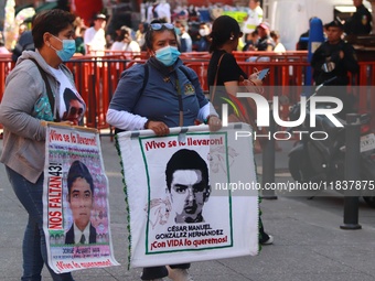 Relatives of the 43 students from the Normal Rural School of Ayotzinapa, victims of forced disappearance in 2014, attend a meeting with the...