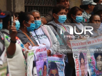 Relatives of the 43 students from the Normal Rural School of Ayotzinapa, victims of forced disappearance in 2014, attend a meeting with the...