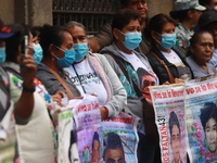 Relatives of the 43 students from the Normal Rural School of Ayotzinapa, victims of forced disappearance in 2014, attend a meeting with the...