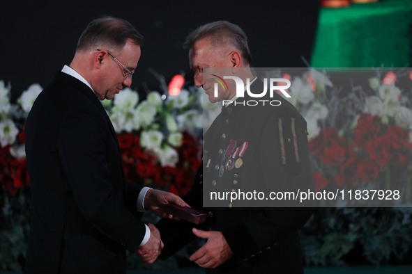 In Wieliczka, Poland, on December 2, 2024, the President of Poland, Andrzej Duda, presents decorations during the celebration of Saint Barba...