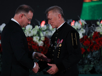 In Wieliczka, Poland, on December 2, 2024, the President of Poland, Andrzej Duda, presents decorations during the celebration of Saint Barba...