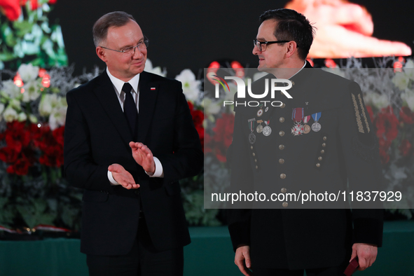 In Wieliczka, Poland, on December 2, 2024, the President of Poland, Andrzej Duda, presents decorations during the celebration of Saint Barba...