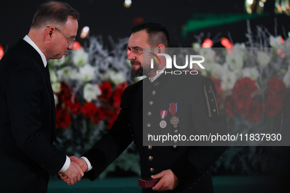 In Wieliczka, Poland, on December 2, 2024, the President of Poland, Andrzej Duda, presents decorations during the celebration of Saint Barba...