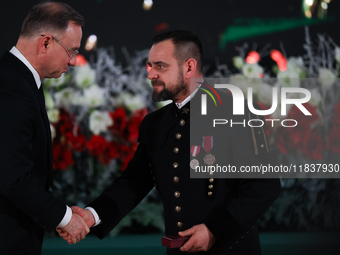 In Wieliczka, Poland, on December 2, 2024, the President of Poland, Andrzej Duda, presents decorations during the celebration of Saint Barba...