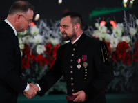 In Wieliczka, Poland, on December 2, 2024, the President of Poland, Andrzej Duda, presents decorations during the celebration of Saint Barba...