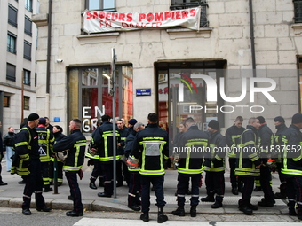 Several hundred firefighters demonstrate during the Lyon Festival of Lights in Lyon, France, on December 5, 2024. They demand the creation o...