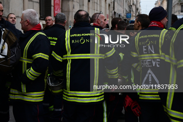 Several hundred firefighters demonstrate during the Lyon Festival of Lights in Lyon, France, on December 5, 2024. They demand the creation o...