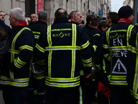 Several hundred firefighters demonstrate during the Lyon Festival of Lights in Lyon, France, on December 5, 2024. They demand the creation o...