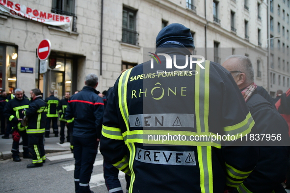 Several hundred firefighters demonstrate during the Lyon Festival of Lights in Lyon, France, on December 5, 2024. They demand the creation o...