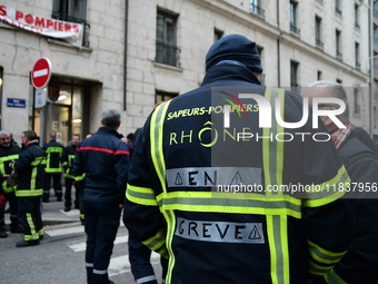 Several hundred firefighters demonstrate during the Lyon Festival of Lights in Lyon, France, on December 5, 2024. They demand the creation o...