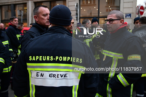 Several hundred firefighters demonstrate during the Lyon Festival of Lights in Lyon, France, on December 5, 2024. They demand the creation o...