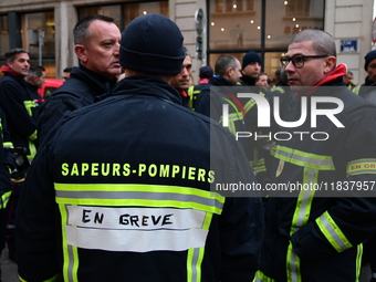 Several hundred firefighters demonstrate during the Lyon Festival of Lights in Lyon, France, on December 5, 2024. They demand the creation o...