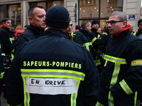 Several hundred firefighters demonstrate during the Lyon Festival of Lights in Lyon, France, on December 5, 2024. They demand the creation o...