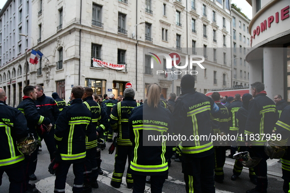 Several hundred firefighters demonstrate during the Lyon Festival of Lights in Lyon, France, on December 5, 2024. They demand the creation o...