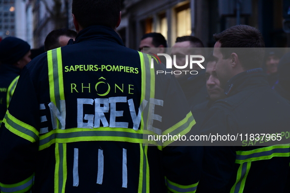 Several hundred firefighters demonstrate during the Lyon Festival of Lights in Lyon, France, on December 5, 2024. They demand the creation o...