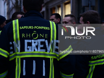 Several hundred firefighters demonstrate during the Lyon Festival of Lights in Lyon, France, on December 5, 2024. They demand the creation o...