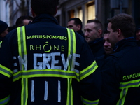 Several hundred firefighters demonstrate during the Lyon Festival of Lights in Lyon, France, on December 5, 2024. They demand the creation o...