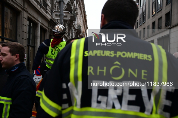 Several hundred firefighters demonstrate during the Lyon Festival of Lights in Lyon, France, on December 5, 2024. They demand the creation o...