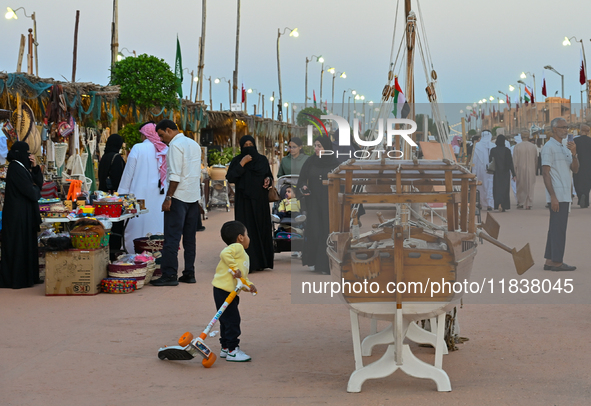 People visit the 14th Katara Traditional Dhow Festival in Katara Cultural Village in Doha, Qatar, on December 5, 2024. The festival celebrat...