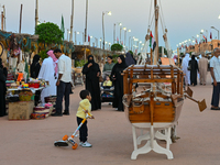 People visit the 14th Katara Traditional Dhow Festival in Katara Cultural Village in Doha, Qatar, on December 5, 2024. The festival celebrat...