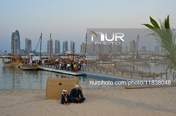 Traditional wooden dhows are on display during the 14th Katara Traditional Dhow Festival in Katara Cultural Village in Doha, Qatar, on Decem...