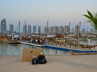 Traditional wooden dhows are on display during the 14th Katara Traditional Dhow Festival in Katara Cultural Village in Doha, Qatar, on Decem...