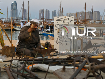 A man makes an anchor during the 14th Katara Traditional Dhow Festival in Katara Cultural Village in Doha, Qatar, on December 5, 2024. The f...