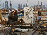 A man makes an anchor during the 14th Katara Traditional Dhow Festival in Katara Cultural Village in Doha, Qatar, on December 5, 2024. The f...