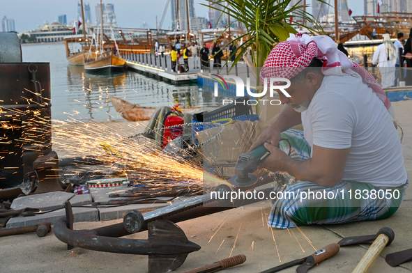 A man makes an anchor during the 14th Katara Traditional Dhow Festival in Katara Cultural Village in Doha, Qatar, on December 5, 2024. The f...