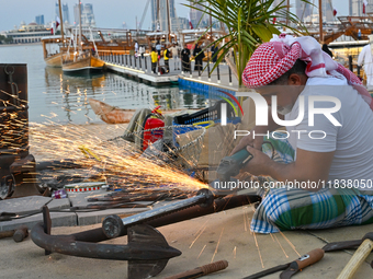 A man makes an anchor during the 14th Katara Traditional Dhow Festival in Katara Cultural Village in Doha, Qatar, on December 5, 2024. The f...