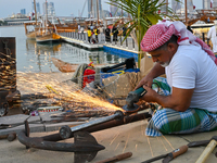 A man makes an anchor during the 14th Katara Traditional Dhow Festival in Katara Cultural Village in Doha, Qatar, on December 5, 2024. The f...