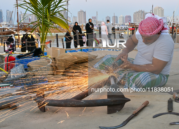 A man makes an anchor during the 14th Katara Traditional Dhow Festival in Katara Cultural Village in Doha, Qatar, on December 5, 2024. The f...