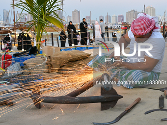 A man makes an anchor during the 14th Katara Traditional Dhow Festival in Katara Cultural Village in Doha, Qatar, on December 5, 2024. The f...